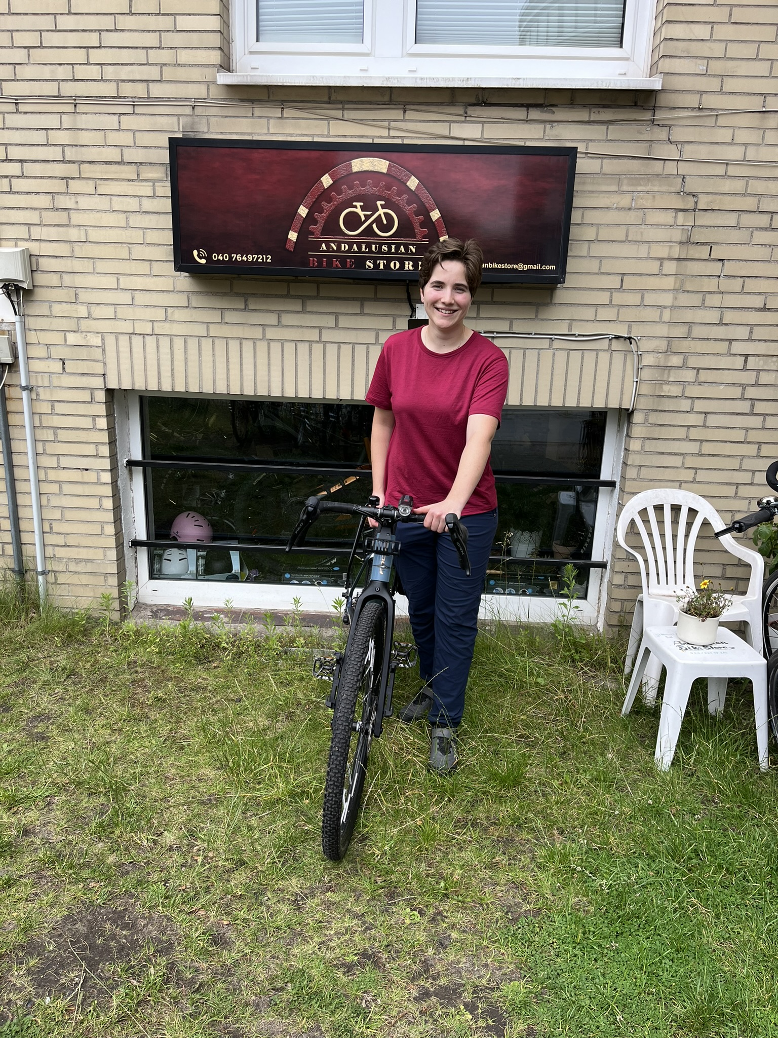 My repaired bike and me at the bike shop!